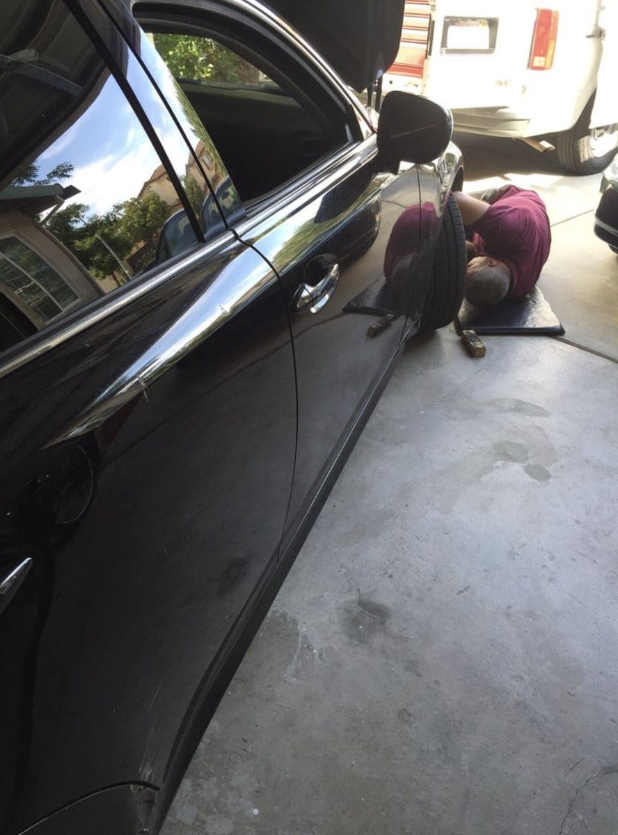 Under-car work during a Savannah garage house call